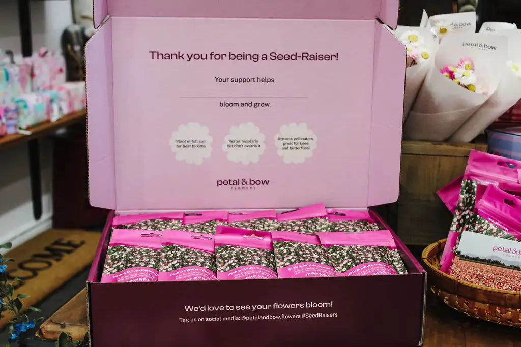 Open Seed-Raisers fundraiser box with individually packaged seed packets