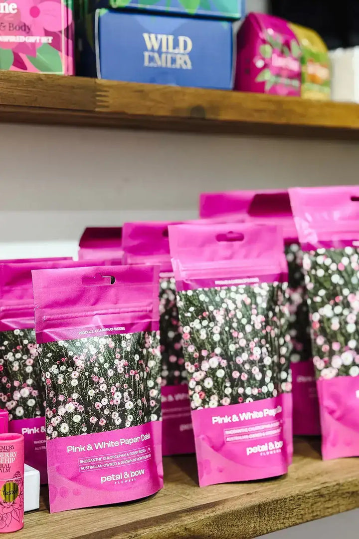 Pink &amp; White Paper Daisy seeds in vibrant pink packets, perfect for meadow gardens and cut flower patches.