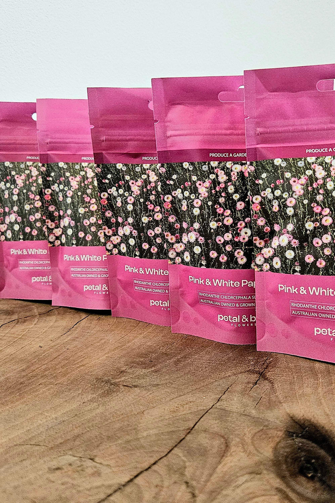 Pink &amp; White paper daisy seeds in vibrant pink packets, perfect for meadow gardens and cut flowers.